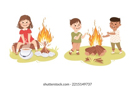 Little children camping around bonfire at summer camp. Happy kids cooking and warming themselves by fire cartoon vector illustration