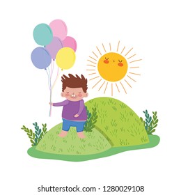 little chubby boy with balloons helium in the landscape