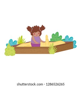 Little chubby girl playing in sand box