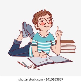 Little, cute boy writing in notebook