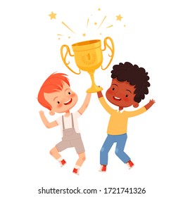 Little cute boys jump and rejoice with a golden cup in their hands. Children's team victory in the competitions