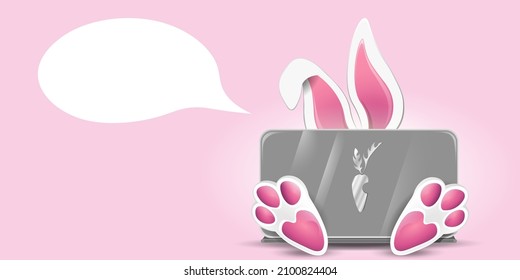Little cute bunny behind laptop. Sale, education and technology concept