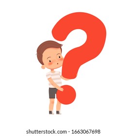 Little cute curious boy holds a question mark. The child asks questions and is interested in the world.