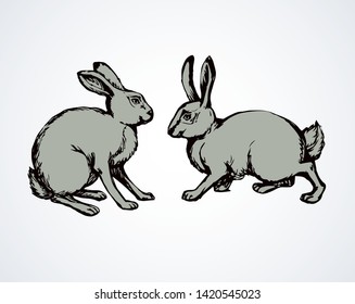Little cute gray leporids lies on light snow backdrop. Freehand linear black ink hand drawn picture logo sketchy in art scribble retro style pen on paper. Closeup view with space for text on sky