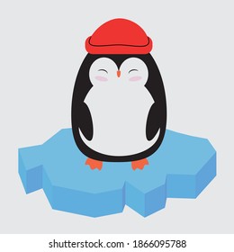 little cute penguin in a red sea cap swims on an ice floe in the ocean