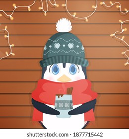A little cute penguin in a winter hat and a scarf holds a hot drink in his hands. Cute penguin, wooden background with garlands. Ready postcard. Vector illustration.