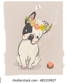 little cute sitting bulldog with wreath on head