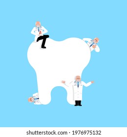 Little dentists treat tooth. Dentists big tooth