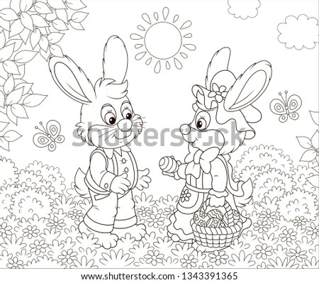 Little Easter Bunnies exchanging colored eggs on a lawn among flowers and flittering butterflies on a sunny spring day, black and white vector illustration in a cartoon style for a coloring book