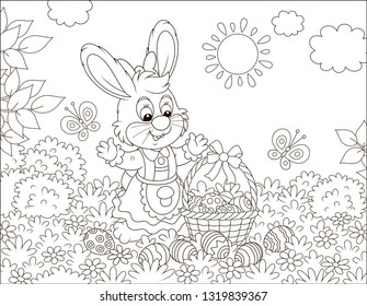 Little Easter bunny with a decorated basket and colorfully painted eggs among flowers, black and white vector illustration in a cartoon style for a coloring book