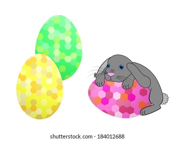 Little Easter bunny rabbit with decorated Easter eggs