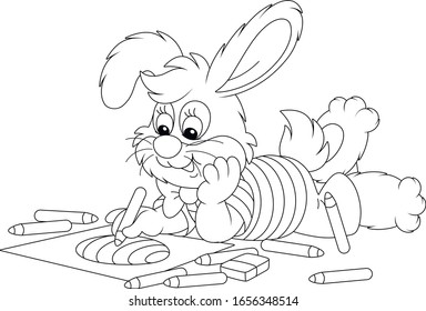 Little Easter Bunny Smiling And Drawing A Decorated Holiday Egg With Color Pencils On A Sheet Of Paper For A Greeting Card, Black And White Vector Cartoon Illustration For A Coloring Book Page