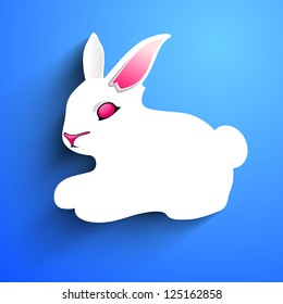 Little Easter rabbit on blue background.