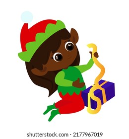 A little elf girl unties the ribbon on a box with a Christmas present. The child is dressed in a traditional red and green costume. Cartoon illustration isolated on white background. 