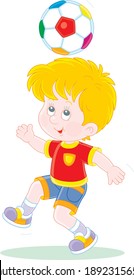 Little football player juggling a colorful ball at a match or training on a sports field, vector cartoon illustration isolated on a white background