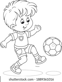 Little football player kicking a ball at a match or training on a sports field, black and white outline vector cartoon illustration for a coloring book page