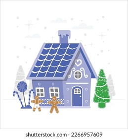 Little gingerbread house with glaze standing on table with tablecloth and decorations, candles and lanterns. Living room with lights and Christmas tree. Holiday mood
