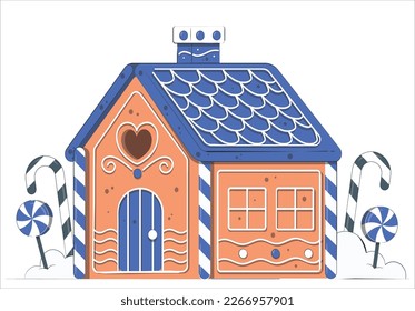 Little gingerbread house with glaze standing on table with tablecloth and decorations, candles and lanterns. Living room with lights and Christmas tree. Holiday mood