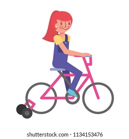 little girl in bicycle with auxiliary rims