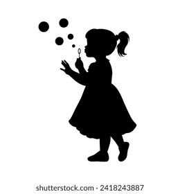 Little girl blowing to make many bubbles, little girl plays with soap bubbles silhouette