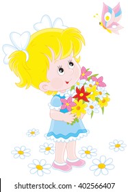 Little girl with a bouquet of flowers looking at a flying butterfly