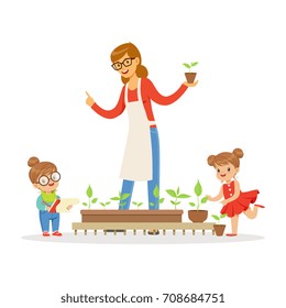 Little girl and boy helping their teacher to care for plants during botany lesson in kindergarten cartoon vector Illustration