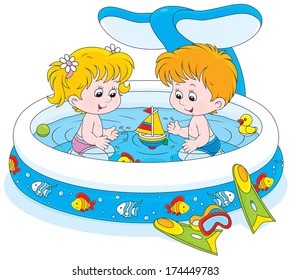 Little girl and boy playing in an inflatable paddling pool in a summer day