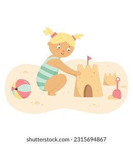 Little girl building sand castle on summer beach