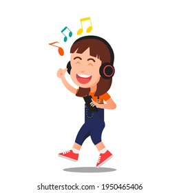 a little girl cheerfully listening to music with headphone