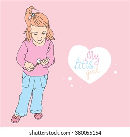 Little girl considering dandelion
