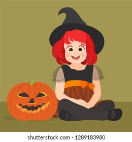 Little girl disguised as a witch with halloween pumpkin