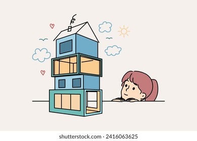 Little girl dreams of own house, seeing model of house in modern architectural style. Child wants to become architect and design houses for comfortable life or to make money from real estate