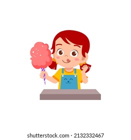 little girl eat sweet cotton candy and feel happy