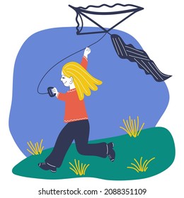 A little girl flying a kite outdoors