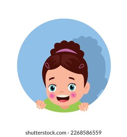 Little girl with a green shirt on looking over a blue circle
