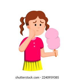 a little girl had a toothache while eating cotton candy