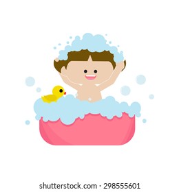 A little girl having bath with rubber duck