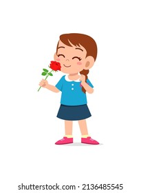 little girl holding flower and sniff the scent