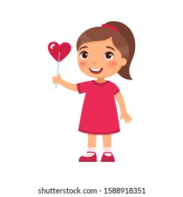 Little girl holding heart shaped candy flat vector illustration. Valentines Day celebration. Smiling child character with lollipop on stick. February 14 holiday isolated design element