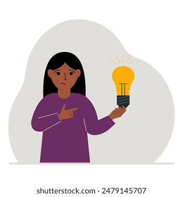 A little girl is holding a light bulb in his hand. Concept of idea, brainstorming, thinking, solution, eureka, bingo homework or find answer.