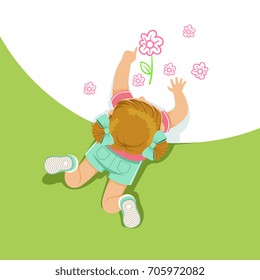 Little girl lying on her stomach and painting flowers with her hands, top view of child on the floor