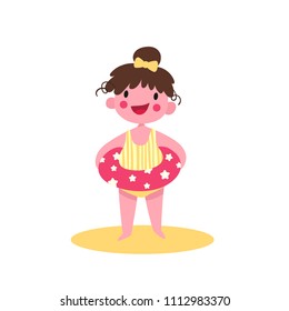 Little girl on the beach with an inflatable tube