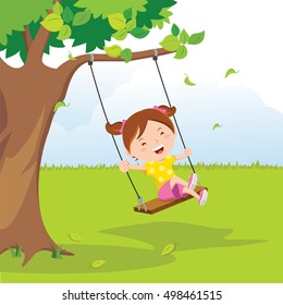 Little girl on swing under a tree