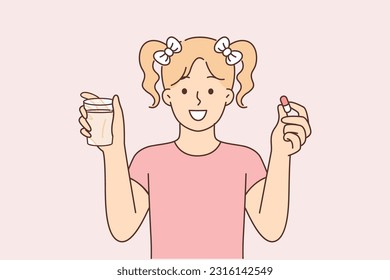 Little girl with pill and glass of water smiles and recommends taking vitamins to improve immunity. Schoolgirl teenager holding capsule in hand taking vitamins complex to resist bacteria