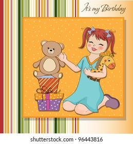 little girl playing with her ??birthday gifts . happy birthday card