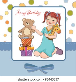 little girl playing with her ??birthday gifts . happy birthday card