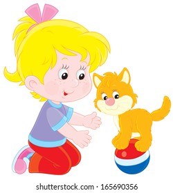 Little girl playing with her kitten