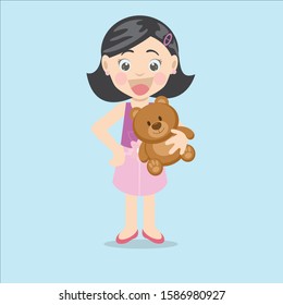 little girl playing with her teddy bear