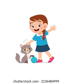 little girl playing together with cute cat