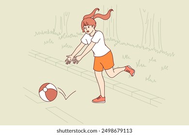 Little girl plays ball on road, putting own life at risk because of lack of parental supervision. Danger for child at risk of becoming victim of accident due to lack of knowledge of traffic rules